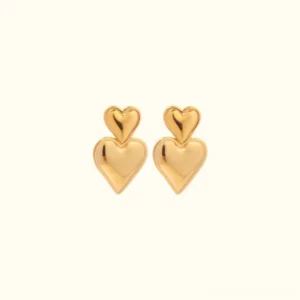 18K gold double heart drop earrings front flat lay view on beige background, polished stacked heart design
