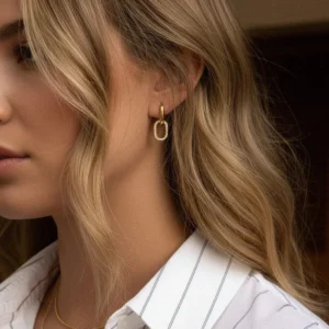 Double hoop diamond earrings worn on model ear, side close-up portrait view showcasing elegant hoop design and diamond sparkle