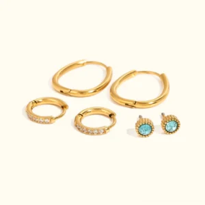 Complete 18K gold earring bundle flat lay display showing all six pieces - two plain gold hoops, two crystal pave hoops, and two blue round studs on white background