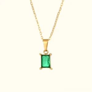 18K gold emerald pendant necklace front view flat lay with rectangular green gemstone and cable chain on light background