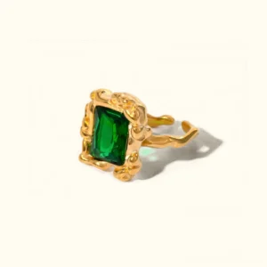 18K gold emerald rectangular statement ring with vintage carved band on white background front flat lay close-up view