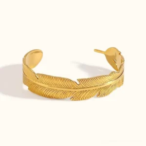 18K gold feather open cuff bracelet front view flat lay on white background with detailed feather texture carving
