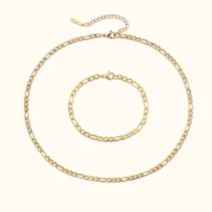18K gold figaro chain necklace and bracelet bundle flat lay complete set top view