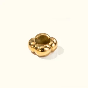 18K gold four-leaf clover ring with polished smooth finish, top-down flat lay view on plain background showcasing hollow clover center design