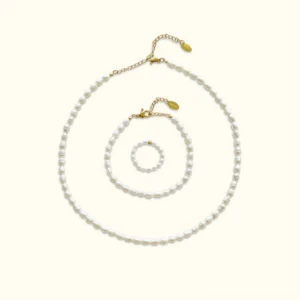 Complete 18K gold freshwater pearl trio set featuring choker necklace, bracelet and ring displayed on neutral background - pearl jewelry bundle