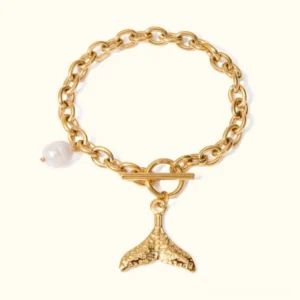 18K gold freshwater pearl mermaid tail bracelet front view flat lay with cable chain and toggle clasp on light background
