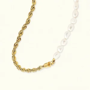 18K gold pearl necklace flat lay overhead view showing twisted gold chain and baroque freshwater pearls with magnetic clasp on white background
