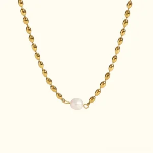 18K gold freshwater pearl necklace with delicate beaded chain and single white pearl on white background - front view flat lay