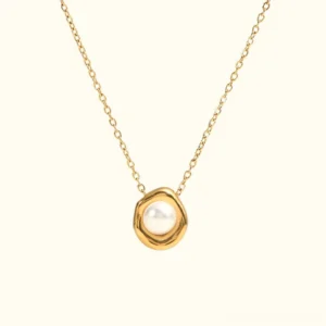 18K gold freshwater pearl pendant necklace flat lay overhead view with irregular gold bezel setting