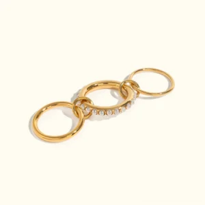 18K gold freshwater pearl stacked interlinked ring set three-piece collection flat lay display
