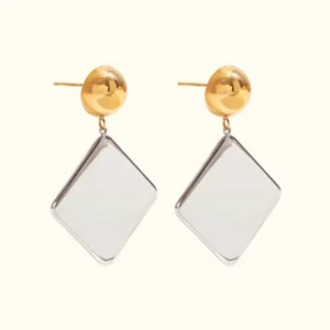 18K gold geometric drop earrings two-tone design with gold sphere stud and silver rhombus pendant flat lay front view