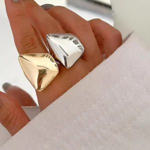 Adjustable 18K gold open ring worn on hand with mixed metal tones and chunky irregular shape