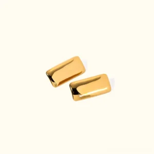 18K yellow gold geometric rectangular stud earrings with polished high-gloss finish displayed on neutral background, minimalist luxury jewelry design