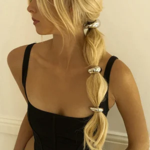 18K gold hammered arch hair cuff worn on blonde ponytail model side profile view