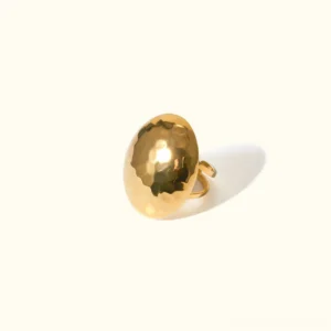 18K gold hammered dome adjustable ring with textured finish in warm golden tone, overhead close-up view showcasing intricate hand-hammered surface details