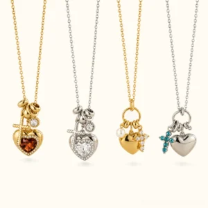 18K gold and silver heart charm necklaces with pearl cross pendants - four style variations in flat lay