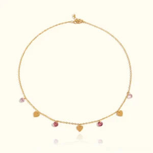 18K gold heart choker necklace with pink crystal beads flat lay display studio shot delicate jewelry