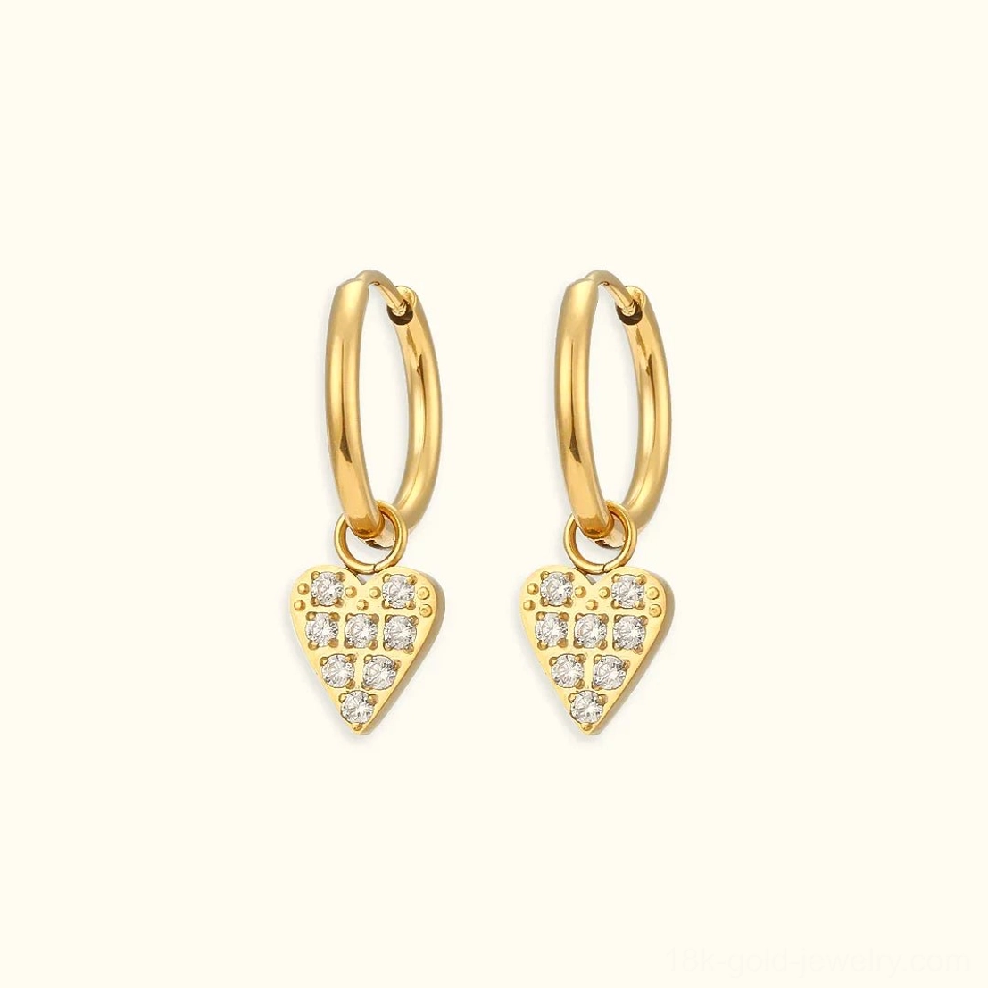 18K gold heart-shaped huggie hoop earrings with grid pavé cubic zirconia setting flat lay