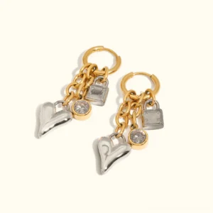 18K gold heart lock charm earrings two tone flat lay with diamond simulants on white background premium jewelry