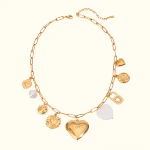 18K gold heart locket necklace flat lay with paperclip chain and pearl charm accents, overhead product view on white background