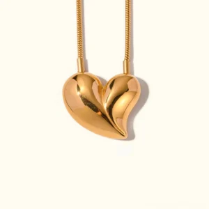 18K gold heart pendant necklace front view flat lay with polished snake chain on white background