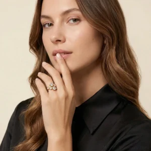 18K gold heart cluster adjustable ring worn on female model right middle finger close-up portrait with black silk shirt