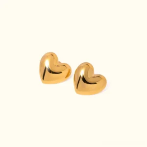 18K gold heart stud earrings flat lay top-down view showcasing polished puffy heart shape with glossy gold finish and lustrous metallic gleam
