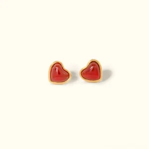 18K gold heart stud earrings with red enamel center and polished gold frame on plain background front view
