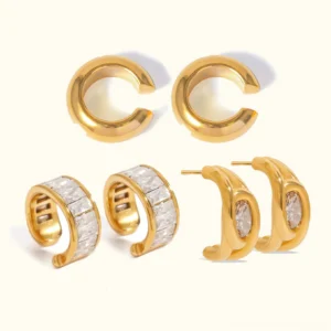 Complete 18K gold earring bundle flat lay featuring three distinct styles smooth polished channel-set diamond and stone hoop designs on neutral background