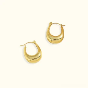18K gold huggie hoop earrings polished crescent flat lay top-down view on white background showcasing smooth polished finish