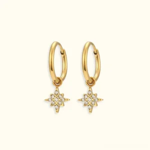 18K gold starburst drop huggie hoop earrings with cubic zirconia charm flat lay front view