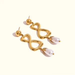18K gold infinity pearl drop earrings flat lay, polished gold tone with dangling teardrop freshwater pearls and secure ball stud backs on plain background
