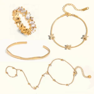 18K gold jewelry bundle flat lay display - complete four-piece set including hand chain, asymmetric diamond ring, cross herringbone bracelet and polished bangle on neutral background