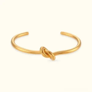 18K gold knot cuff bangle flat lay view polished finish open cuff design