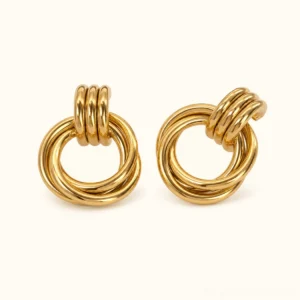 18K gold knotted hoop earrings front view flat lay polished twisted knot design sculptural gold earrings