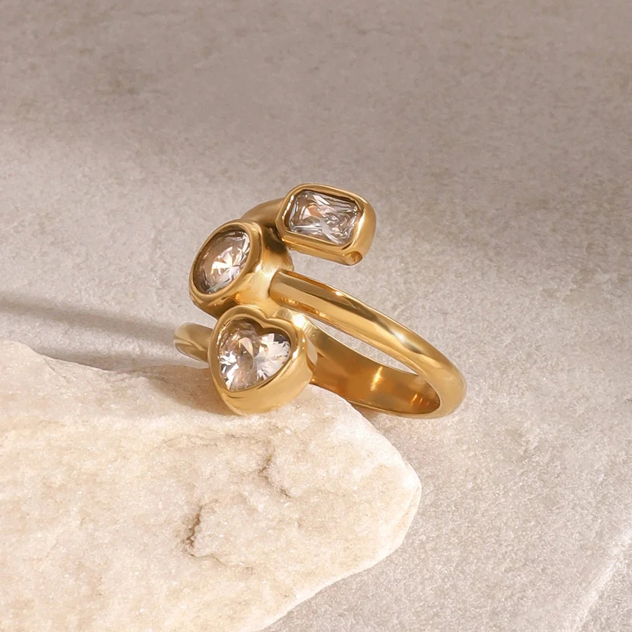 18K gold layered diamond ring side flat lay view showing stacked band structure and gem placement