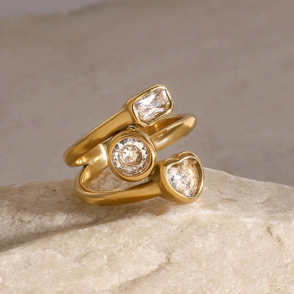18K gold layered diamond ring three-quarter side view displaying mixed gemstone cuts and band architecture