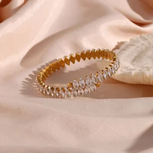 18K yellow gold marquise diamond cuff bracelet side angle elegant styling on silk