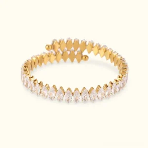 18K gold marquise diamond tennis bracelet flat lay product shot showing full row of sparkling gemstones with polished gold finish