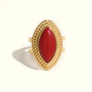 18K gold marquise ring with twisted rope frame and red stone, front flat lay view showcasing intricate gold detailing