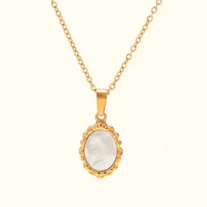 18k gold mother of pearl vintage pendant necklace flat lay front view with ornate oval frame and iridescent pearl center