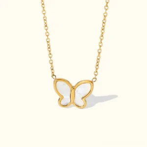 18K gold mother of pearl butterfly necklace flat lay front view, delicate hollow butterfly pendant with white pearl inlay, polished gold cable chain on neutral background