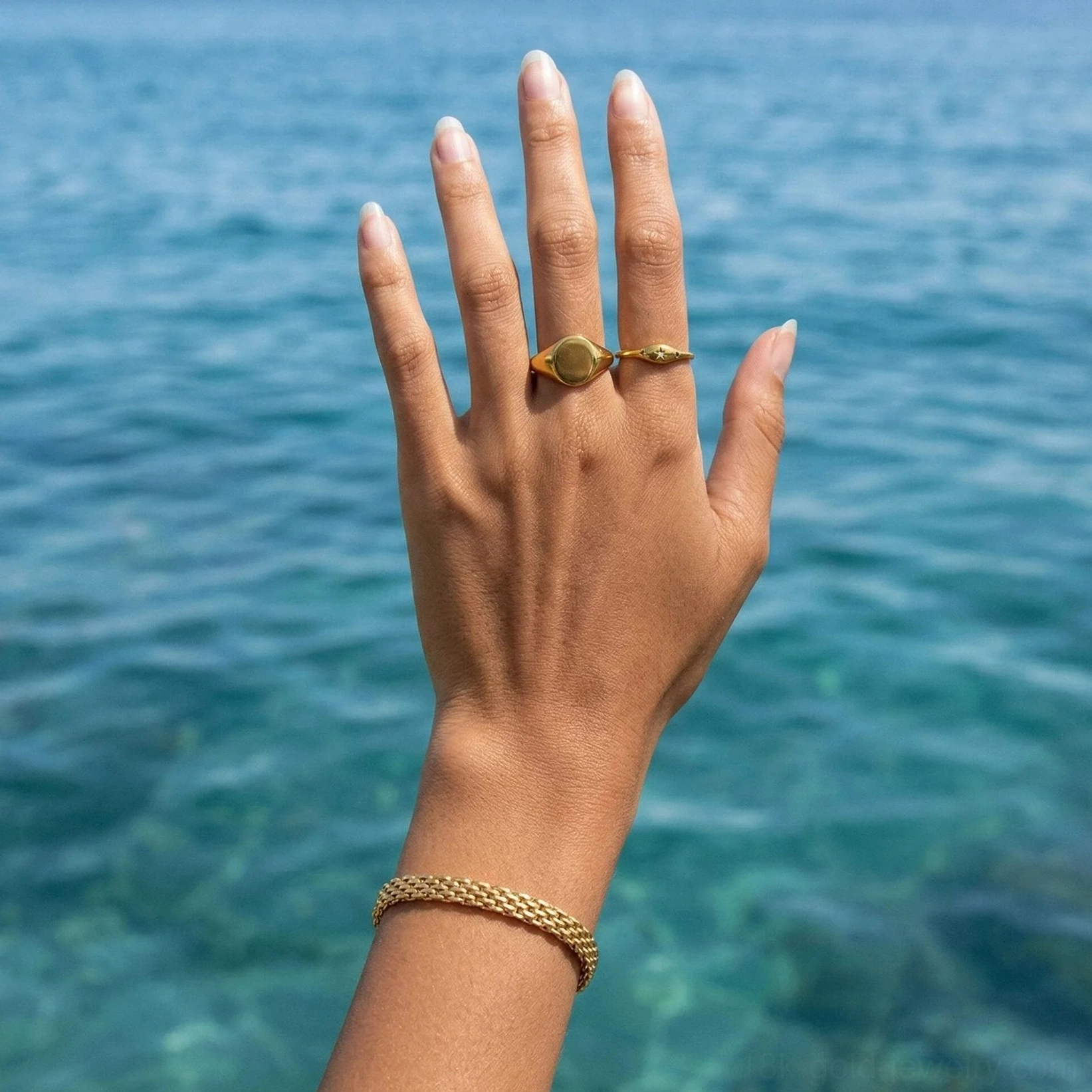 18K Gold Multi-Chain Bracelet Paired with Signet Rings - Close-Up Hand Detail Tropical Beach