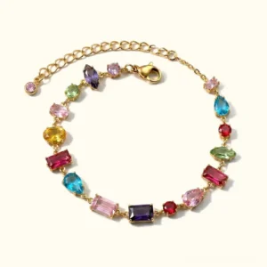18K gold multicolor gemstone bracelet top-down flat lay view featuring precision-cut AAAAA diamond simulant crystals in mixed vibrant hues with adjustable gold chain extension