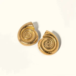 18K gold nautilus shell stud earrings flat lay - spiral conch design with brushed texture on white background