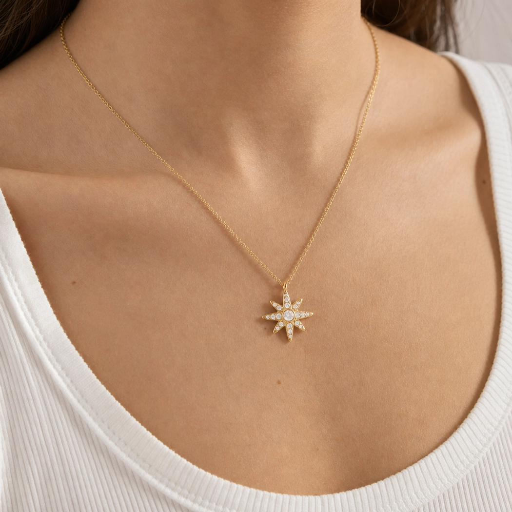 18K gold single north star pendant necklace on-body front close-up shot model wearing white tank top with pavé star charm