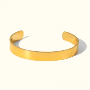 18K gold open cuff bracelet flat lay front view polished smooth finish minimalist design