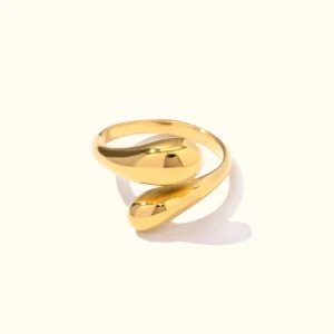 18K gold open cuff ring with twisted teardrop wrap design, polished finish flat lay on white background