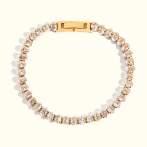 18K gold oval cut tennis bracelet with cubic zirconia stones, flat lay top view on neutral background