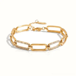 18K gold paperclip chain bracelet with crystal pave links flat lay top view